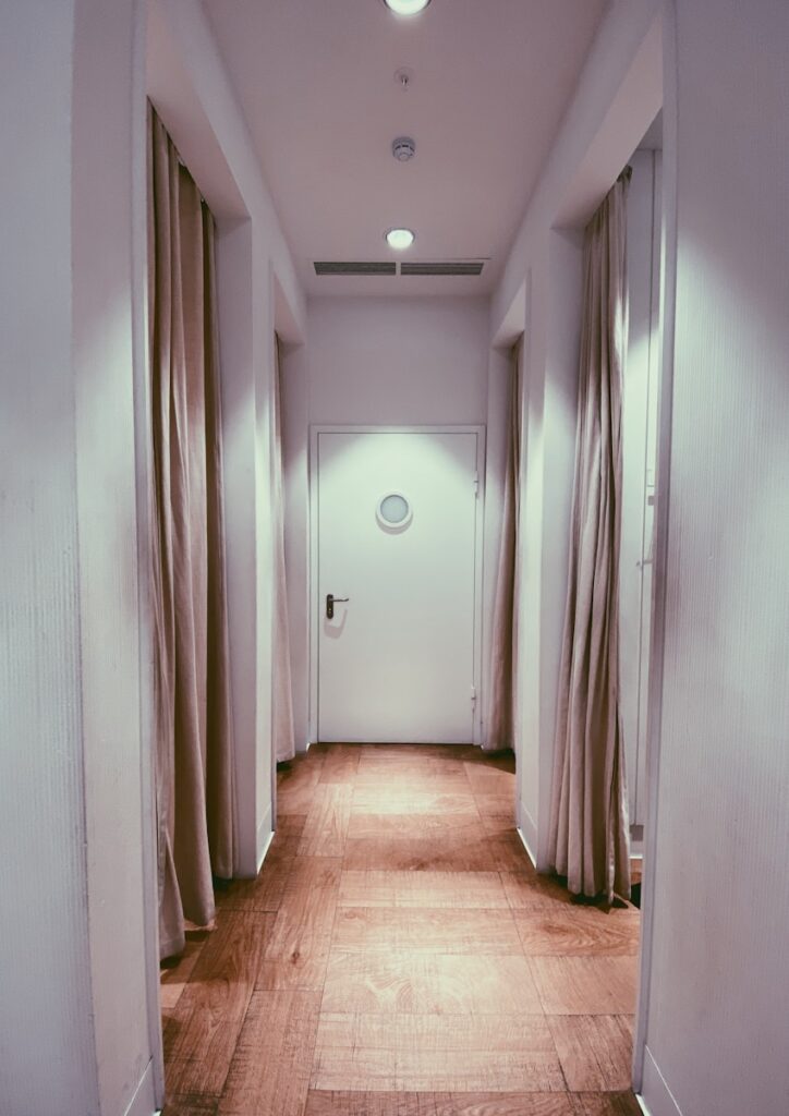 brown wooden parquet floor with white wall paint